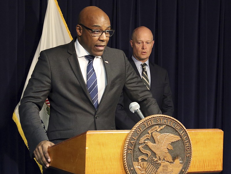 Attorney General Kwame Raoul, left, and Kane County State's Attorney Joseph McMahon speak during a news conference Monday, Feb. 11, 2019, in Chicago. Raoul and McMahon, who won the conviction against Jason Van Dyke, said they believe Judge Vincent Gaughan did not properly apply the law when he sentenced Van Dyke to six years and nine months in prison. In a rare move, they filed a request with the Illinois Supreme Court seeking an order that would send the case back to Gaughan for a new sentence. (AP Photo/Noreen Nasir)