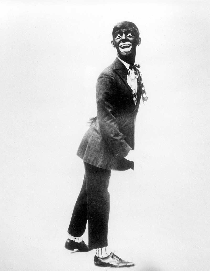 FILE - This 1920s image shows comedian Eddie Cantor wearing blackface while performing "If You Knew Susie." Blackface minstrelsy is considered by some to be the first uniquely American form of entertainment. White men would darken their faces to create caricatures of black people, including large mouths, lips and eyes, woolly hair and coal-black skin. (AP Photo/File)
