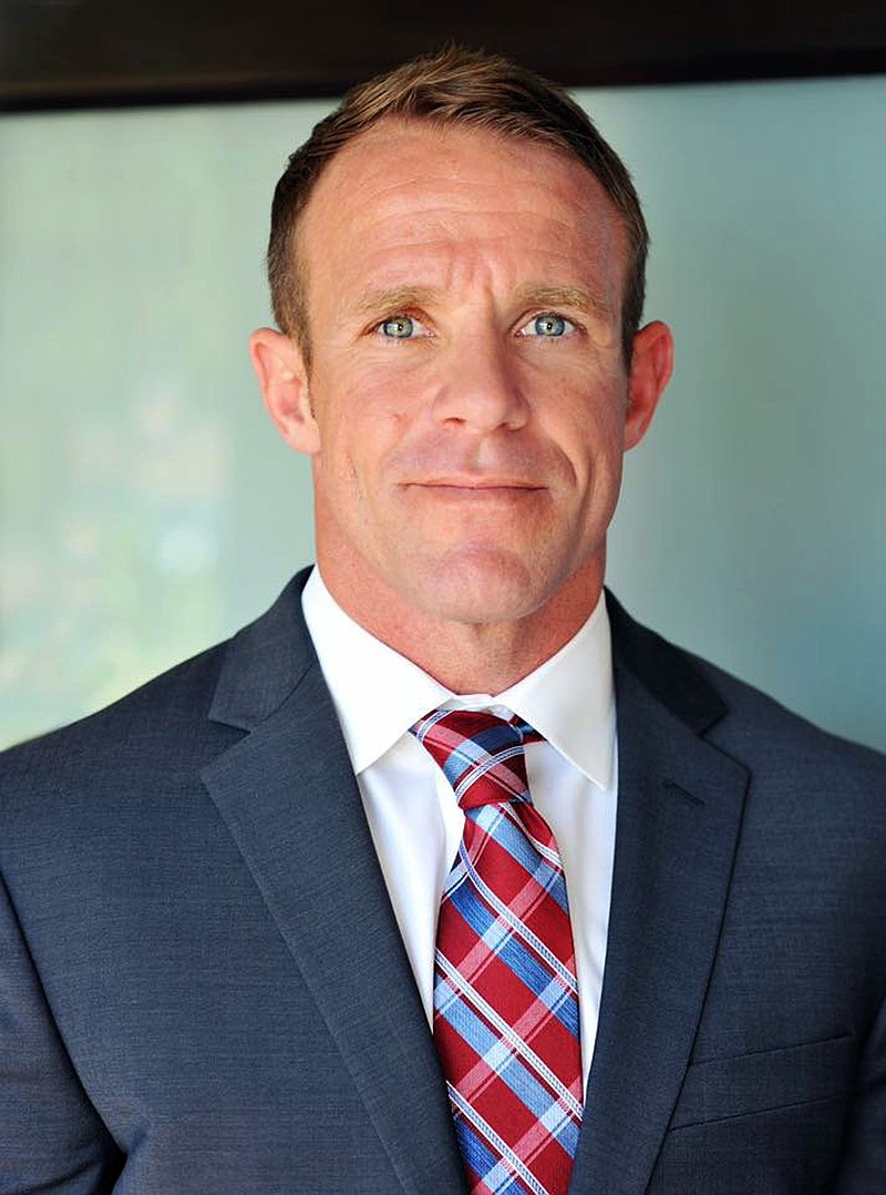 FILE - This 2018 file photo provided by Andrea Gallagher shows her husband, Navy SEAL Edward Gallagher. A military judge on Tuesday, Feb. 12, 2019, asked the Navy to address claims that allegations from a potential government witness were being leaked to the media in the case of Gallagher, a SEAL charged with murder in the 2017 death of an Iraqi war prisoner. (Andrea Gallagher via AP, File)