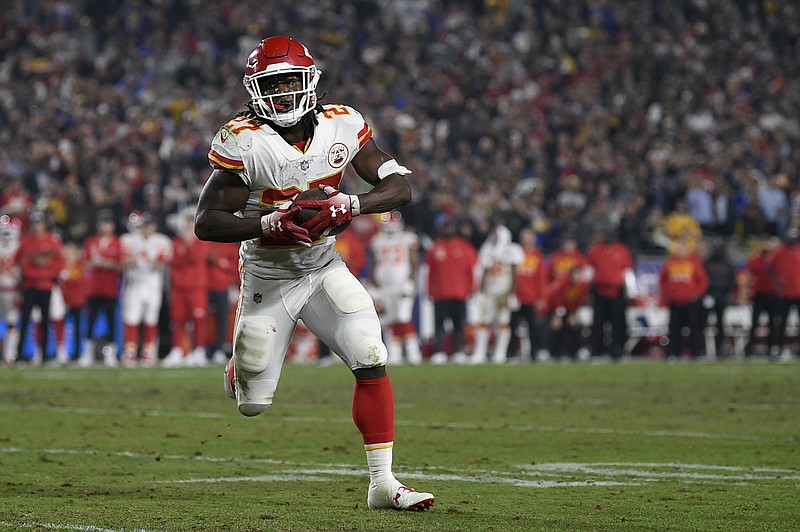 This Nov. 19, 2018, file photo shows Kansas City Chiefs running back Kareem Hunt in action during the second half of an NFL football game against the Los Angeles Rams in Los Angeles. The lasting image of Kareem Hunt's second NFL season wasn't him stiff-arming a linebacker, shedding a tackle or barreling over a cornerback at the goal line for a touchdown. It was him pushing a woman and then kicking her while she was defenseless on the floor. That disturbing moment caught on surveillance video mortified the sports world. The Cleveland Browns believe it was a random act by a young man who feels remorse and deserves a second chance. (AP Photo/Kelvin Kuo, File)