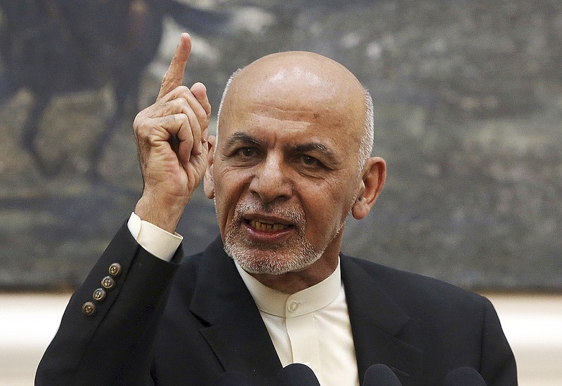 FILE - In this July 15, 2018, file photo, Afghan President Ashraf Ghani speaks during a press conference at the presidential palace in Kabul, Afghanistan. The Afghan government has fired its election commission, Tuesday, Feb. 12, 2019. The move by Ghani’s administration comes more than three months after chaotic parliamentary elections -- the results of which have still not been announced -- and ahead of July’s controversial presidential vote. (AP Photo/Rahmat Gul, File)