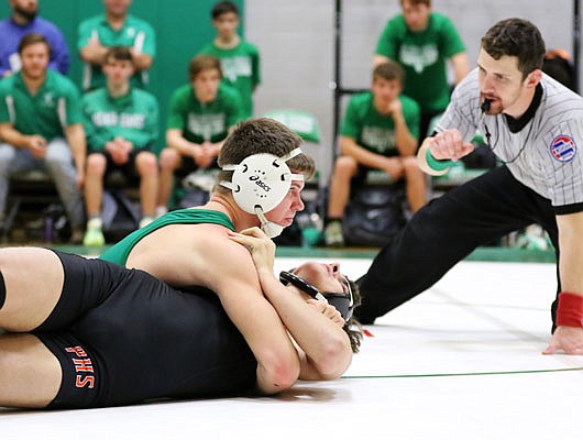 Kyler Griep of Blair Oaks tries to pin Palmyra's Connor Roberts during a 170-pound match this season at Blair Oaks Middle School in Wardsville.