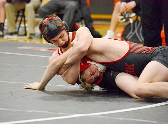 Clayton Hurley of the Jays works to control Elijah Maskrod of Ozark during a dual this season at Fleming Fieldhouse.