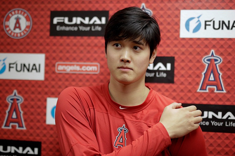 Los Angeles Angels' Shohei Ohtani talks to the media at their spring baseball training facility in Tempe, Ariz., Wednesday, Feb. 13, 2019. The AL Rookie of the Year is recovering from Tommy John surgery. (AP Photo/Chris Carlson)