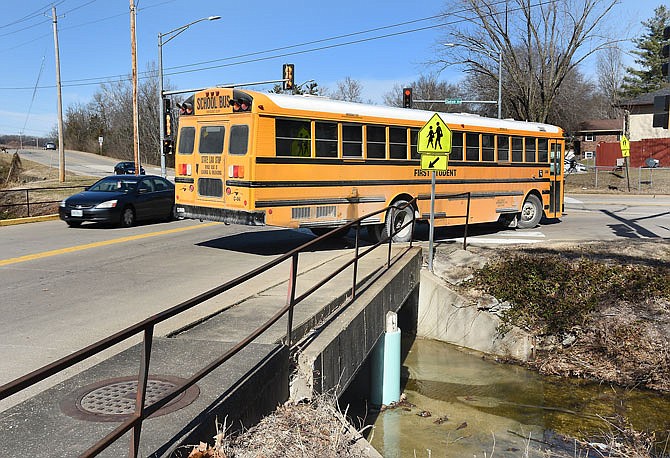 A school bus on Satinwood Drive waits to make a right turn onto Stadium Boulevard on Thursday.