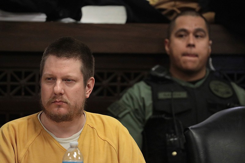 In this Jan. 18, 2019 file photo, former Chicago police Officer Jason Van Dyke attends his sentencing hearing at the Leighton Criminal Court Building in Chicago, for the 2014 shooting of Laquan McDonald. The wife of the white Chicago police officer who fatally shot the black teenager McDonald said on Wednesday, Feb. 13, 2019, that her husband has been assaulted by inmates in his cell at a Connecticut prison. The Chicago Sun-Times reports that Tiffany Van Dyke says Jason Van Dyke had been placed in the prison's general population before being assaulted. (Antonio Perez/Chicago Tribune via AP, Pool, File)