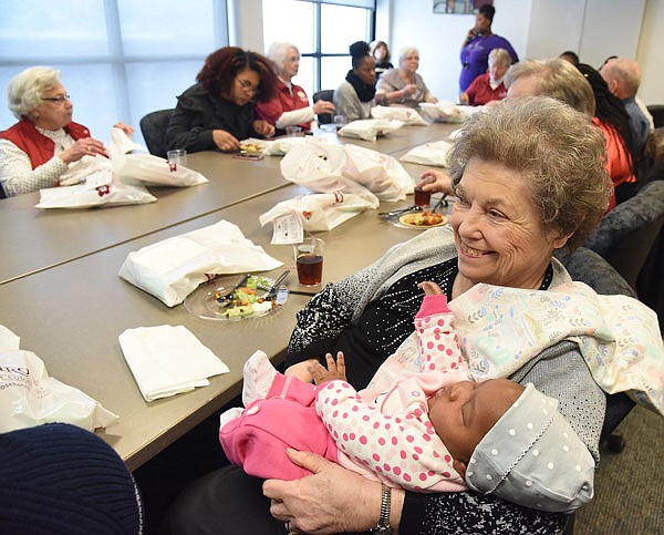 Breaun Grover, left, talks to Melvin Proctor on Friday as the two become familiar during a visit of Lincoln University by Primrose Retirement Community residents. Grover, a college junior who hails from Waukegan, Illinois, plans to attend law school after she finishes her courses at LU. 