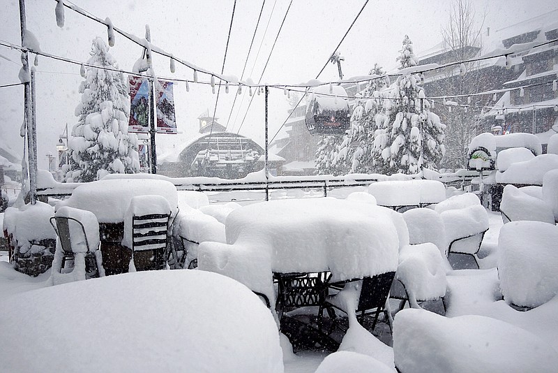 This Friday, Feb. 15, 2019, photo released by Heavenly Mountain Resort shows snow covering chairs and ski equipment at Heavenly Mountain Resort near South Lake Tahoe, Calif. Skiers eager to hit the slopes had to sit out a Presidents' Day holiday weekend as heavy snow and rain fell for a fourth straight day Friday in California's mountains, where the snow was so deep in some areas plows couldn't go out and cities were running out of places to pile it. (Duncan Kincheloe/Heavenly Mountain Resort via AP)