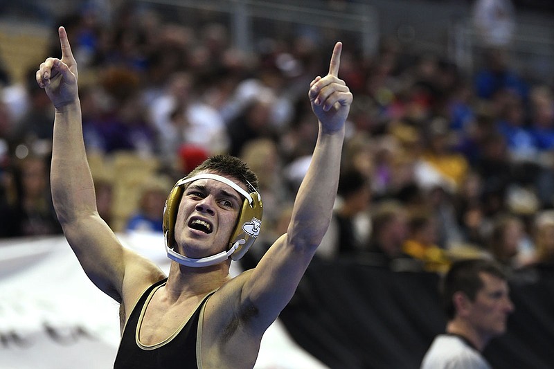 Eldon's Isaiah Simmons celebrates after winning the 113-pound Class 2 championship match Saturday in the state wrestling championships at Mizzou Arena.
