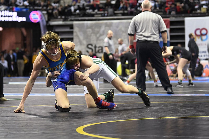 Fatima's Lucas Laux wrestles Logan Ferrero of Whitfield on Saturday during the 120-pound match in the Class 1 state wrestling championships at Mizzou Arena.