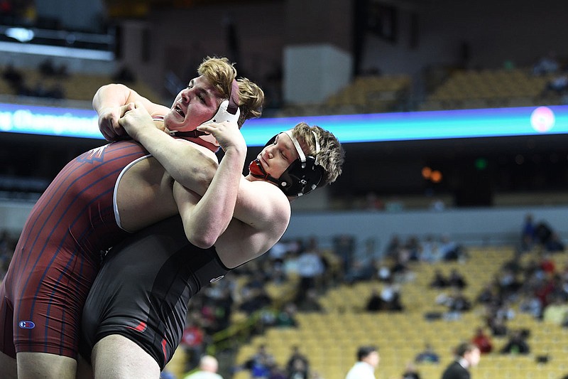 Brandon Backues of the Jays pulls Joplin's Jadyn Withrow to the mat during Saturday's 220-pound fifth-place match in the Class 4 state wrestling championships at Mizzou Arena.