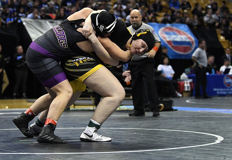 Alana May of Versailles pulls down Lexie Cole of Kearney during Saturday's Class 1 girls 235-pound match in the state wrestling championships at Mizzou Arena.