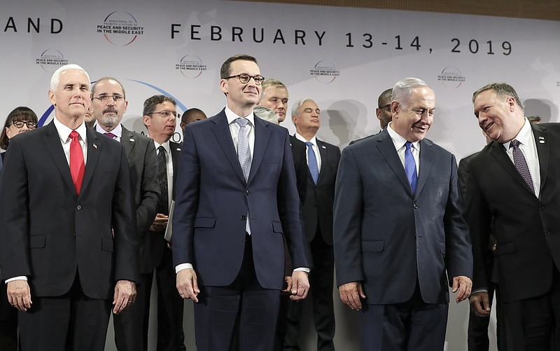FILE - In this Thursday, Feb. 14, 2019 file photo, United States Vice President Mike Pence, Prime Minister of Poland Mateusz Morawiecki, Israeli Prime Minister Benjamin Netanyahu and United State Secretary of State Mike Pompeo, from left, stand on a podium at a conference on Peace and Security in the Middle East in Warsaw, Poland. A two-day security conference in Warsaw was supposed to be a crowning achievement for Israeli Prime Minister Benjamin Netanyahu, stamping a seal on his long-held goal of pushing his behind-the-scenes ties with Arab leaders into the open. Instead, the publicity-seeking Israeli leader made one embarrassing misstep after another, distracting attention from his main mission and sending his aides into a nonstop cycle of damage control. (AP Photo/Michael Sohn, File)