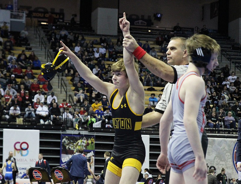 Fulton freshman Owen Uhls celebrates while having his hand raised after capturing a Class 2 state title at 106 pounds with a dominating 9-0 major decision over Mexico freshman Keith Ransom late Saturday afternoon in the 89th MSHSAA Wrestling Championships at Mizzou Arena in Columbia. Uhls became Fulton's third freshman state champion in the last nine years.