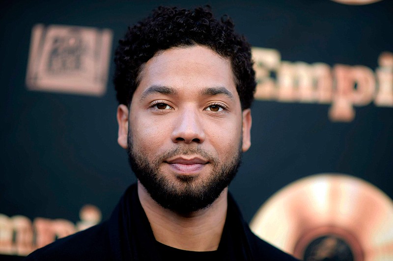 In this May 20, 2016 file photo, actor and singer Jussie Smollett attends the "Empire" FYC Event in Los Angeles. Chicago police say they're interviewing two "persons of interest" who surveillance photos show were in the downtown area where Smollett says he was attacked last month. A police spokesman said Thursday the two men aren't considered suspects but may have been in the area at the time Smollett says he was attacked. Smollett says two masked men shouted racial and homophobic slurs before beating him and putting a rope around his neck on Jan. 29. (Richard Shotwell/Invision/AP, File)