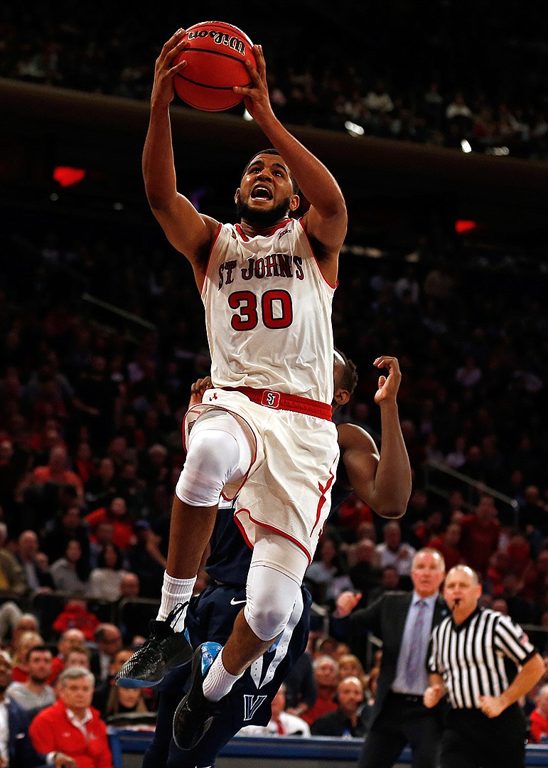  St. John's guard LJ Figueroa drives to the basket against Villanova on Sunday during the second half of an NCAA basketball game in New York.