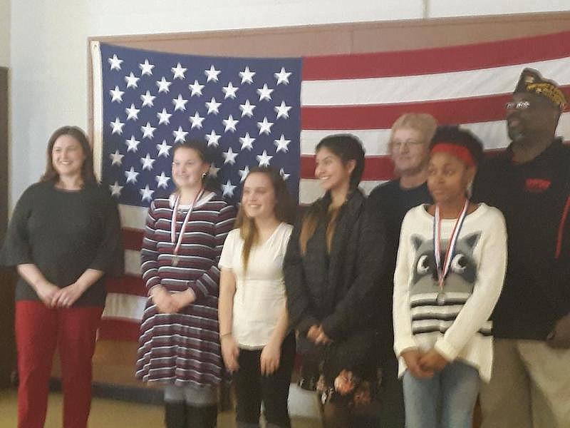 FILE: The 2019 Voice of Democracy high school essay contest first-place winner was Lydia Mason. Patriot's Pen middle school essay contest first-place winner was Bre'Awn Richmond, second place Yahaira Pereida and third-place Gabrella LLoyd.