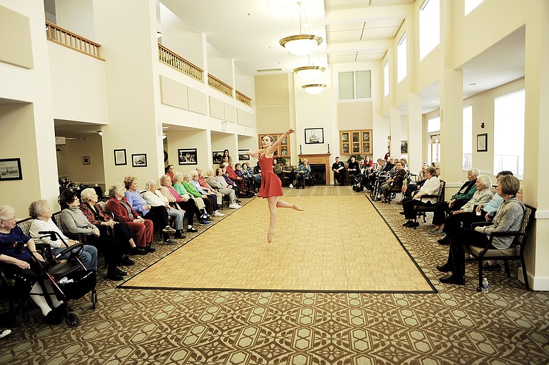 About 50 people gathered Monday in the dining hall at Heisinger Bluffs to witness performances by Sophia Schepers, shown here, and others. Schepers is to participate in a ballet competition in Kansas City this weekend.