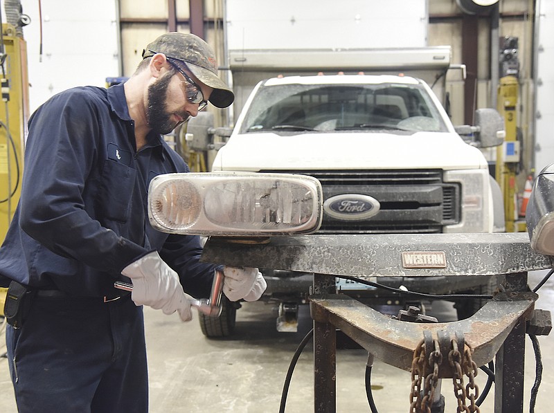 Wes Kampeter disassembles a plow mounting frame from a city plow truck Monday in order to replace the aging, rusty mount. Kampeter and fellow technicians and mechanics have been working steadily to maintain, repair and/or replace necessary equipment to keep Jefferson City snow removal trucks and on the road. 