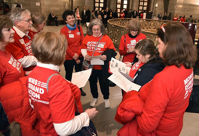 After a general gathering session and group photograph, those participating in Moms Demand Action day at the Capitol on Tuesday broke into smaller groups to lobby their respective legislators on a bill aimed at protecting people from gun violence.