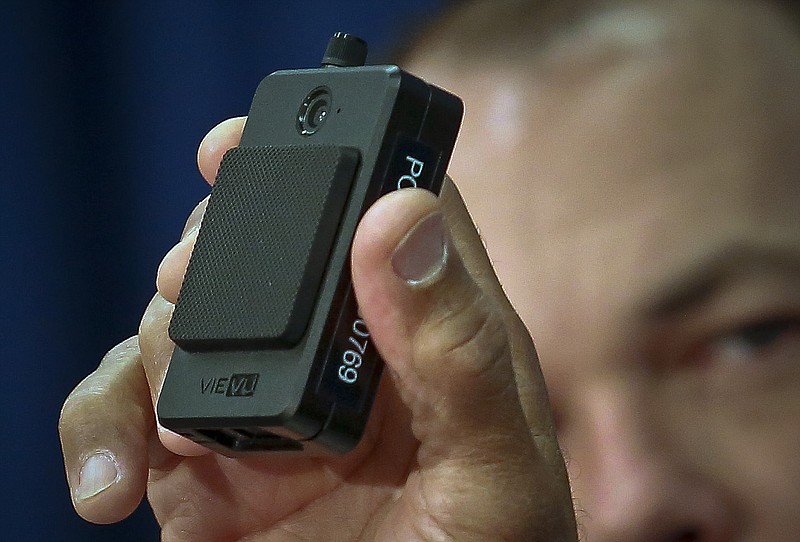 File - In this Jan. 30, 2018 file photo, a newly issued police body camera is shown during a NYPD news conference in New York. A New York appeals court has ruled that police body camera footage is subject to public disclosure under state law. (AP Photo/Bebeto Matthews, File)