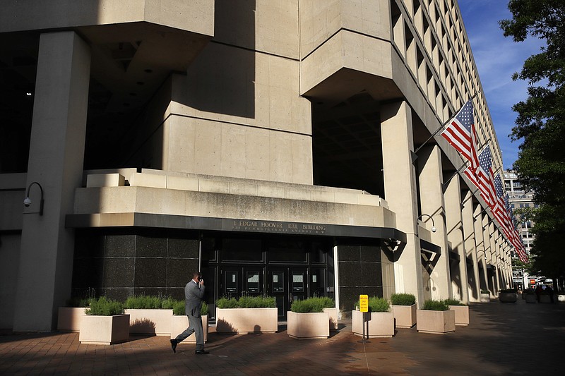 FILE - In this May 9, 2017, file photo, the J. Edgar Hoover FBI building on Pennsylvania Avenue in Washington. The FBI developed a backup plan to protect evidence in its Russia investigation soon after the firing of FBI Director James Comey in the event that other senior officials were dismissed as well, according to a person with knowledge of the discussions. (AP Photo/Jacquelyn Martin, File)