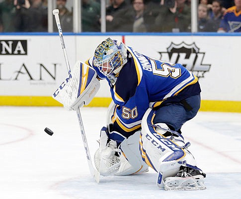 Blues goaltender Jordan Binnington makes a stick save during the first period of Tuesday night's game against the Maple Leafs in St. Louis.