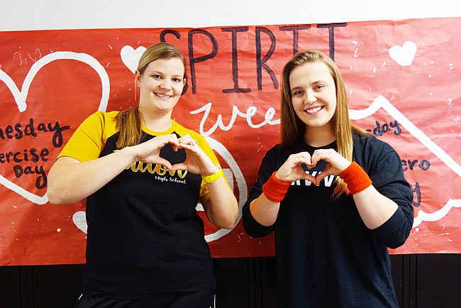 Liz Schwab, left, a science teacher at Fulton High School, and junior Alexandra White are helping promote the American Heart Association this week. Students can wear themed costumes and purchase T-shirts, with funds going to the AHA.