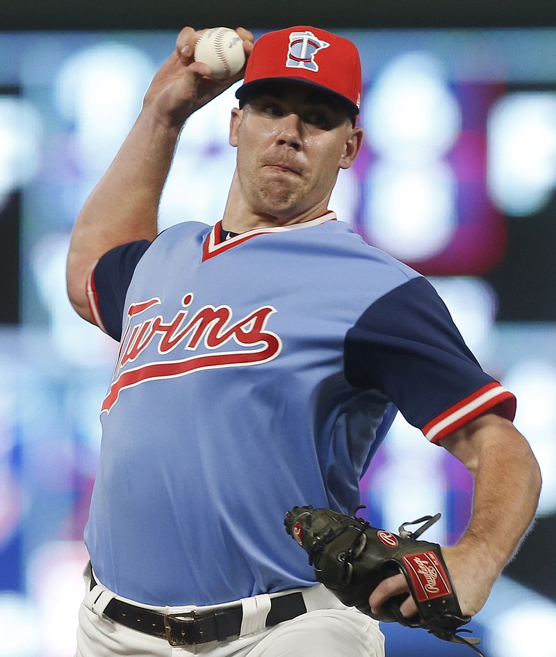 In this Aug. 25, 2018, file photo, Minnesota Twins pitcher Trevor May throws against the Oakland Athletics during a baseball game in Minneapolis. The Minnesota Twins have a handful of candidates to be their closer this season, the biggest question to be answered during spring training. The leading contenders are newcomer Blake Parker, returners Trevor May, Trevor Hildenberger, Taylor Rogers and Addison Reed along with young converted starter Fernando Romero. (AP Photo/Jim Mone, File)