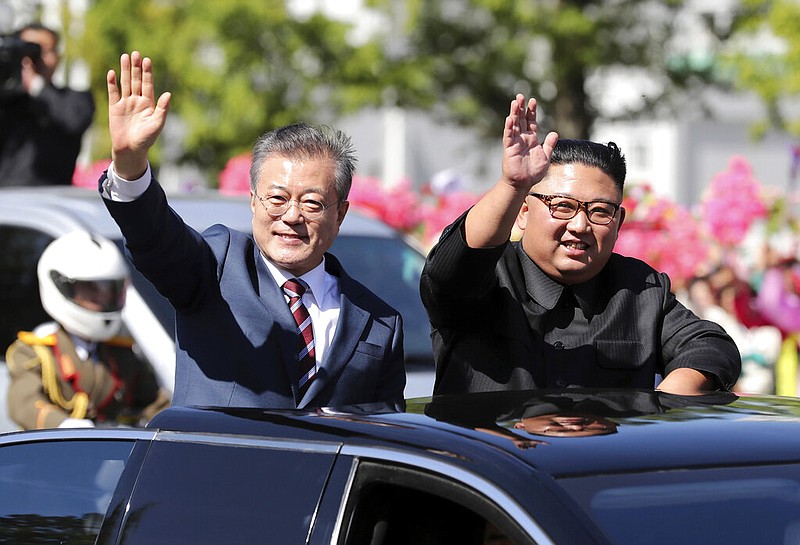 In this Sept. 18, 2018, file photo, South Korean President Moon Jae-in, left, and North Korean leader Kim Jong-un ride in a car during a parade through a street in Pyongyang, North Korea. The upcoming Trump-Kim meeting will be a crucial moment for South Korean President Moon Jae-in, who is desperate for more room to continue his engagement with North Korea, which has been limited by tough U.S.-led sanctions against Pyongyang. 