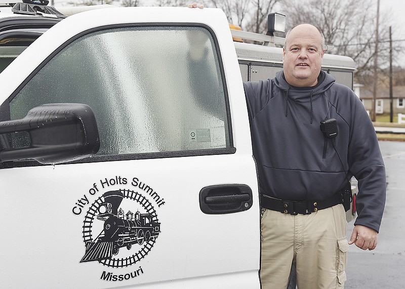 Kevin Ward poses next to his official vehicle. For three years, Ward has been the animal control officer for the city of Holts Summit. On top of enforcing ordinances and responding to calls, Ward runs the Holts Summit Animal Control Facebook page.