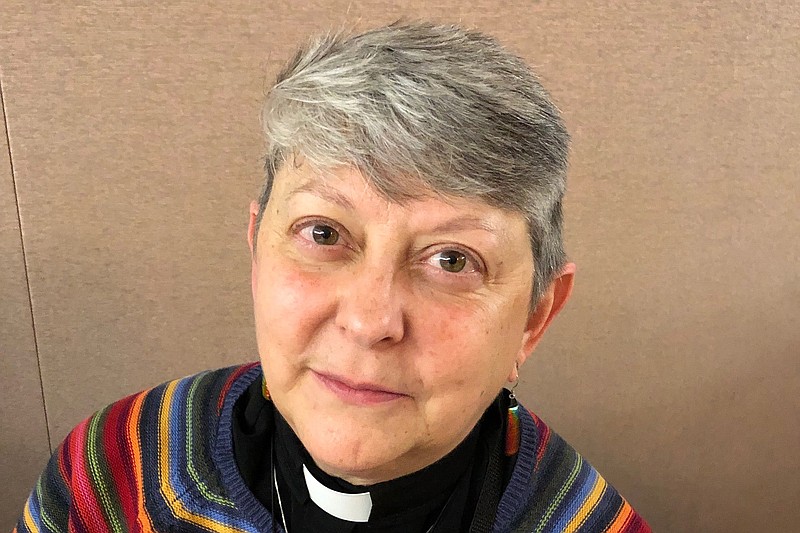 Lois McCullen Parr, 60, a United Methodist elder of Albion, Mich., poses for a picture at a national Methodist conference Monday, Feb. 25, at in St. Louis. Nearly 900 delegates will decide whether America's second-largest Protestant denomination will fracture due to divisions over same-sex marriage and the ordination of LGBT clergy. Parr identifies as bi-sexual and queer and said no one should be left out of God's love. (AP Photo/Jim Salter)