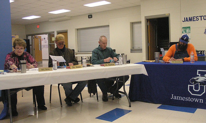 Jamestown School Board members Susan Borts, Dr. John Jones, Don Barbour and Stephen Derendinger at their Feb. 14, 2019, meeting.