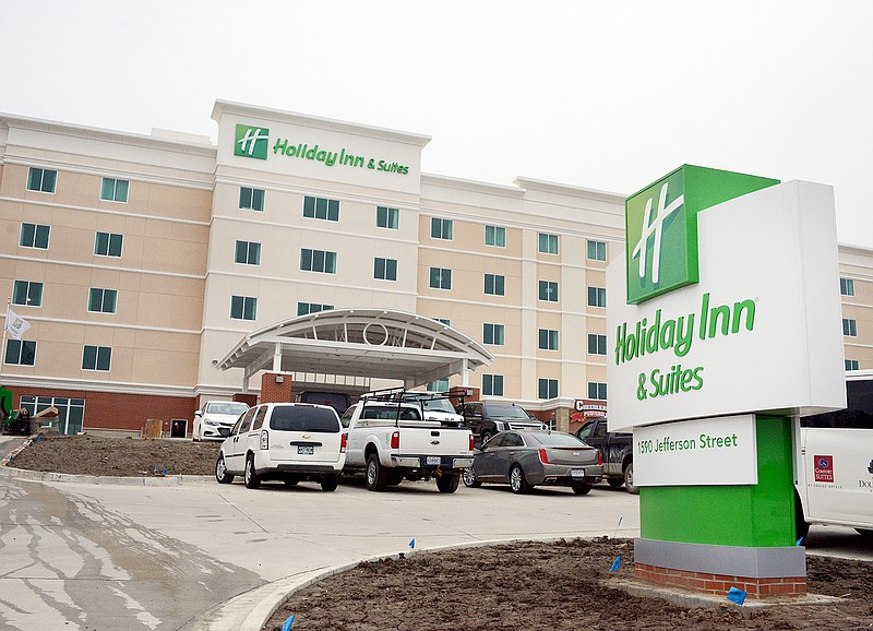 The Holiday Inn entrance sign is displayed Wednesday at 1590 Jefferson St. The hotel's top three floors opened for reservations today while the rest of the hotel remains under construction.