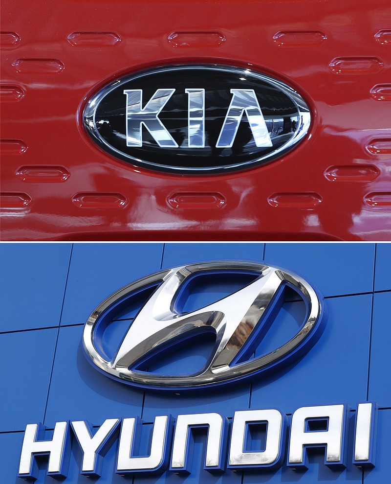 FILE- This combination of file photos shows the logo of Kia Motors during an unveiling ceremony on Dec. 13, 2017, in Seoul, South Korea, top, and Hyundai logo on the side of a showroom on April 15, 2018, in the south Denver suburb of Littleton, Colo., bottom. Hyundai and Kia are recalling more than a half million vehicles in the U.S. because of new problems that can lead to engine fires. Documents posted Thursday, Feb. 28, 2019, by the government show the Korean automakers are adding three recalls after reports of fires across the country. (AP Photo, File)