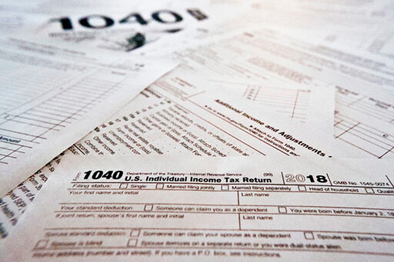 Multiple forms printed from the Internal Revenue Service web page that are used for 2018 U.S. federal tax returns are shown Feb. 13 in Zelienople, Pa.  It's tough to know all the answers at tax time, particularly in a year with massive tax law changes. Sometimes people need help, but where should they turn? There are several options.   


