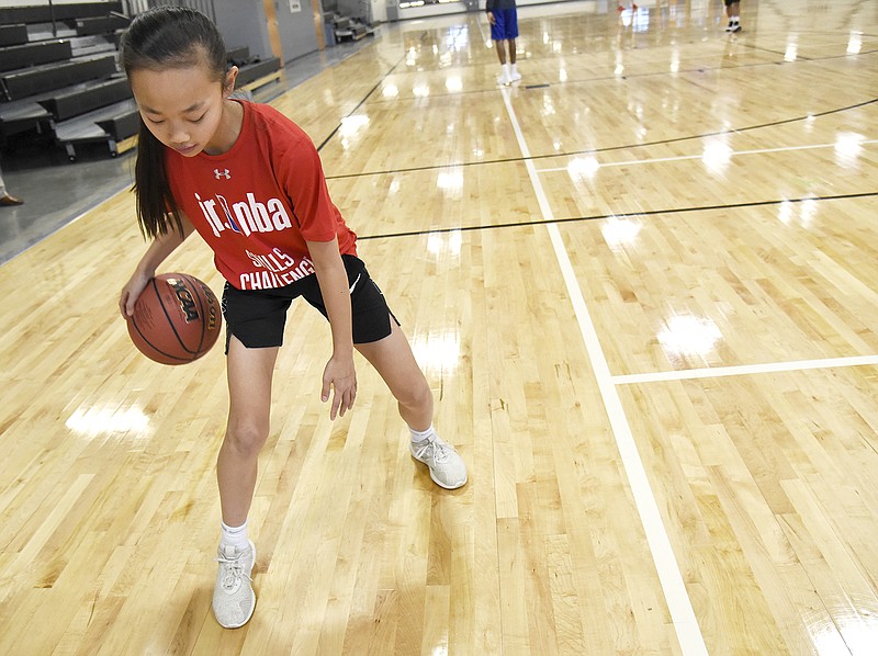 Jefferson City resident Maddy Larkin, 11, practices her basketball skills Monday at The Linc. Larkin competed in the Jefferson City Parks, Recreation and Forestry Department's Jr. NBA Skills Challenge last month. After coming in second place, she traveled to Indianapolis where she won regionals, earning her an all-expense-paid trip to New York to compete in the finals in June and see the NBA draft. Photo by Jenna Kieser/News Tribune