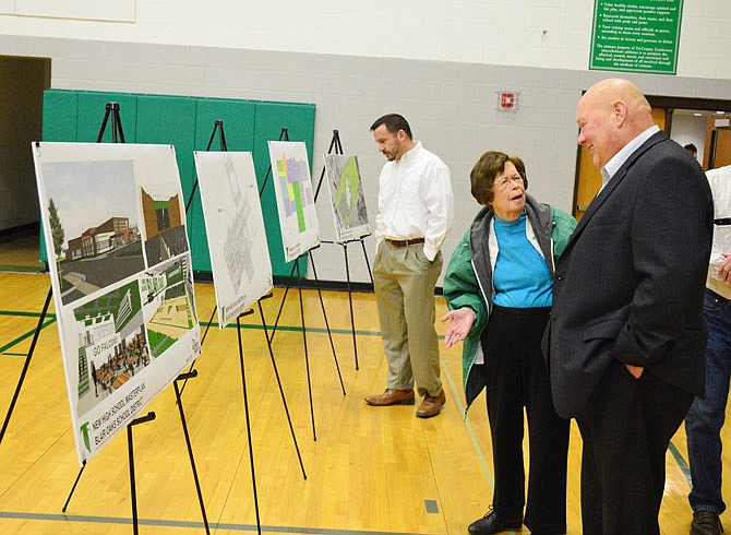 Attendees at the News Tribune forum Tuesday, March 5, 2019, at Blair Oaks Middle School view possible design concepts for the proposed new Blair Oaks High School, which will be featured on the April 2 ballot.