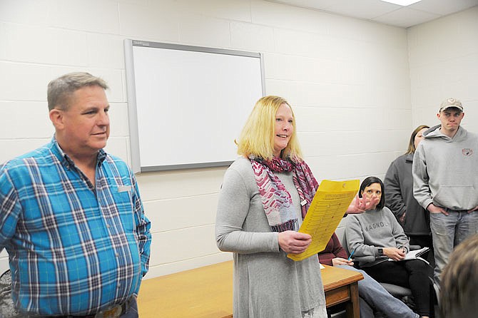 Eugene shooting sports coach Ed Hager and parent Karen Koetting address the school board Feb. 28. Accompanied by more than 20 community members, they requested the board vote to offer letters for shooting sports.