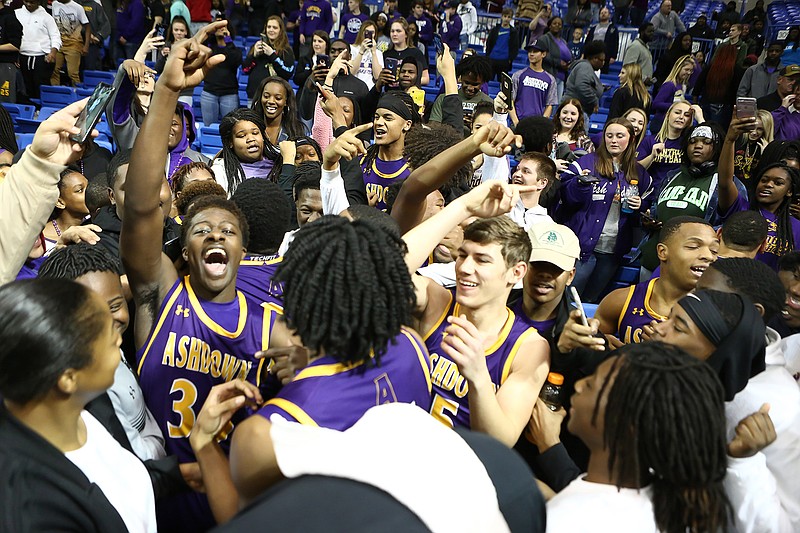 Ashdown players and fans celebrate after the Panthers won the Class 3A basketball state championship against Drew Central on Thursday at Hot Springs Convention Center in Hot Springs, Ark.
