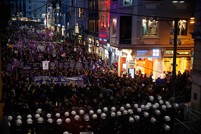 Turkish police block protesters wanting to hold a march for the International Women's Day, at Istiklal street, the main shopping street in Istanbul, Friday, March 8, 2019. The day has been sponsored by the United Nations since 1975 as millions around the world are demanding equality amid a persistent salary gap, violence and widespread inequality. (AP Photo/Lefteris Pitarakis)