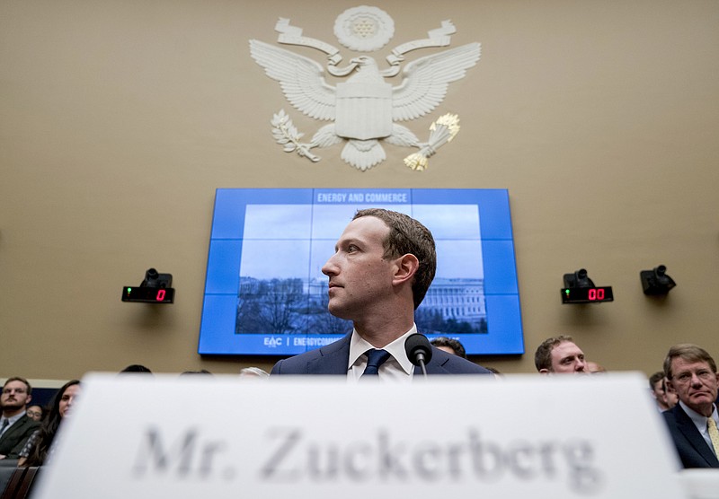 FILE - In this April 11, 2018, file photo Facebook CEO Mark Zuckerberg arrives to testify before a House Energy and Commerce hearing on Capitol Hill in Washington. Zuckerberg’s new “privacy-focused vision” for Facebook looks like a transformative mission statement for the much-criticized social network. But critics say the announcement obscures Facebook’s deeper motivations: To expand lucrative new commercial services, continue monopolizing the attention of users and to develop new data sources for tracking people. (AP Photo/Andrew Harnik, File)