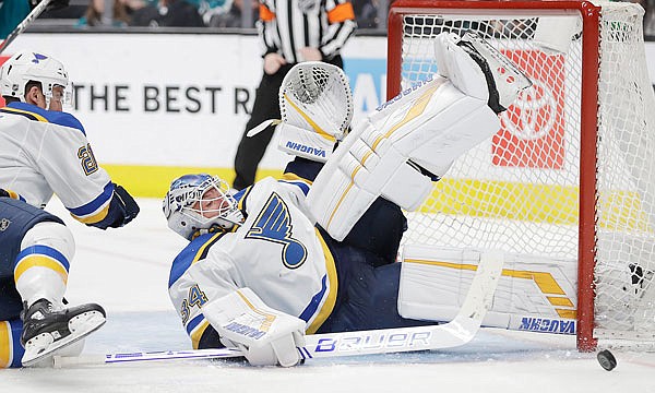 Blues goalie Jake Allen blocks a shot from the Sharks in the third period of Saturday's game in San Jose, Calif.