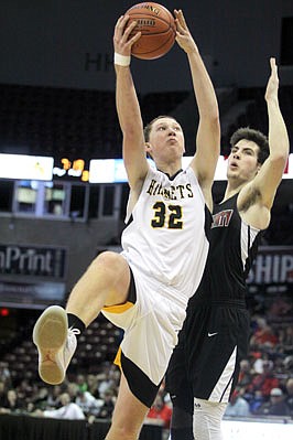 Ross Struemph of St. Elizabeth drives past Chadley Waltz of Linn County during the second half of Saturday's Class 1 third-place game at JQH Arena in Springfield.