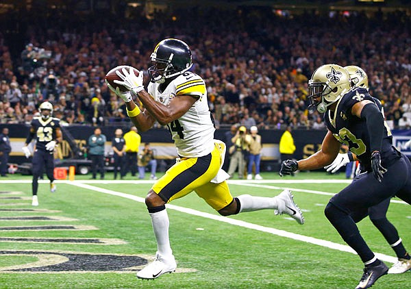 In this Dec. 23, 2018, file photo, Steelers wide receiver Antonio Brown pulls in a pass reception in front of Saints cornerback Marshon Lattimore (foreground right) and strong safety Kurt Coleman in the second half of a game in New Orleans.