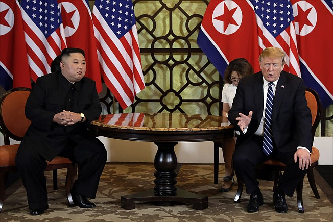 In this Feb. 28, 2019, file photo, U.S. President Donald Trump, right, meets North Korean leader Kim Jong Un in Hanoi, Vietnam. North Korea is reportedly restoring facilities at its long-range rocket launch site that it had dismantled as part of disarmament steps last year. The development came after a high-stakes nuclear summit between Kim and Trump ended without any agreement. (AP Photo/Evan Vucci, File)