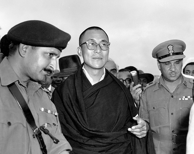  In this April 18, 1959, file photo, Tibetan spiritual leader the Dalai Lama, center,  arrives at Tezpur, Assam in India. Tibetan activists put up posters and hoisted a Tibetan flag in India's capital New Delhi on Sunday, March 10, 2019, to mark the 60th anniversary of 1959 uprising against Chinese rule. (AP Photo, File)
