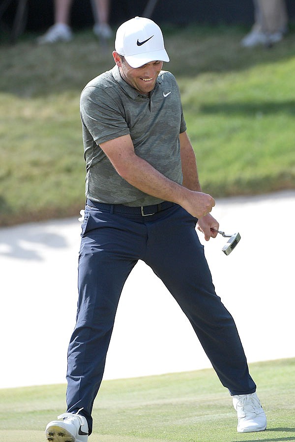 Francesco Molinari celebrates after sinking a putt for birdie on the 18th green during Sunday's final round of the Arnold Palmer Invitational in Orlando, Fla.