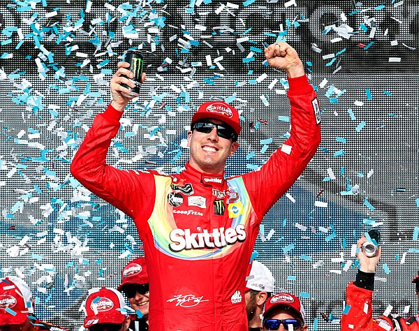 Kyle Busch celebrates in victory lane Sunday after winning the NASCAR Cup Series race at ISM Raceway in Avondale, Ariz.