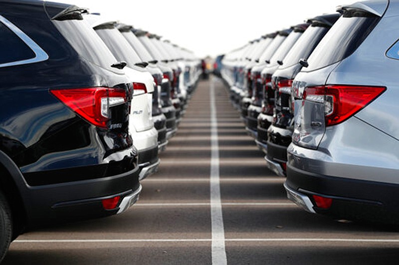 Long lines of unsold 2019 Pilot sport-utility vehicles sit at a Honda dealership on Nov. 28, 2018, in Highlands Ranch, Colo. New vehicle prices and interest rates are on the rise, causing millions of people to fall behind on their auto loan payments. But experts say you can avoid being one of them by preparing yourself before you buy and not getting caught up in the emotional moment of going after all the options that you desire. 

